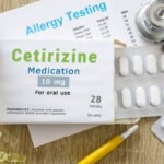 Cetirizine medication or allergy drug concept photo. On  doctor table is pack with words "Cetirizine medication" and pills for treatment of allergy and hypersensitivity